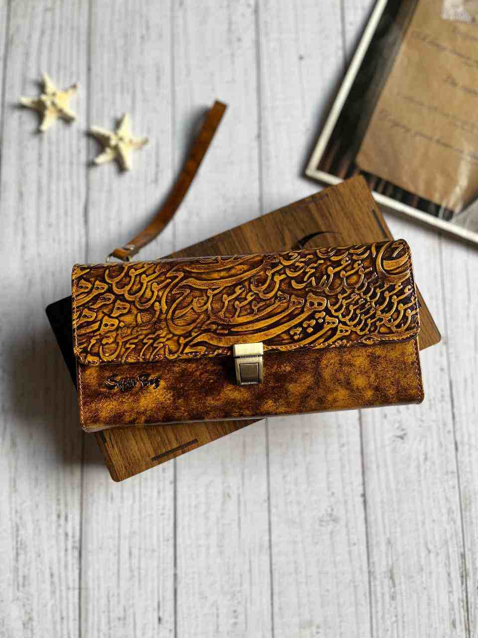 خرید کیف پول دستی چرم گاوی دسترنگ طرح دار